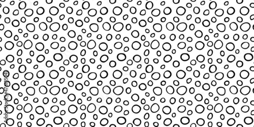 Spotty abstract vector seamless pattern. Random rings, dots, circles, spots, stains, bubbles, stones. Design for fabric, funny cute print. Irregular random texture. Repetitive graphic background
