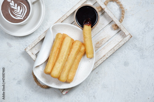 Churros,spanish traditional dessert and chocolate dipping photo