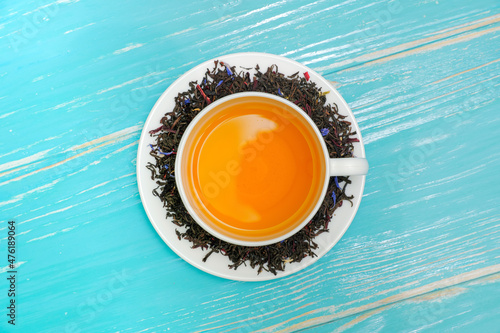 High resolution photo: Cup with tea , around brew