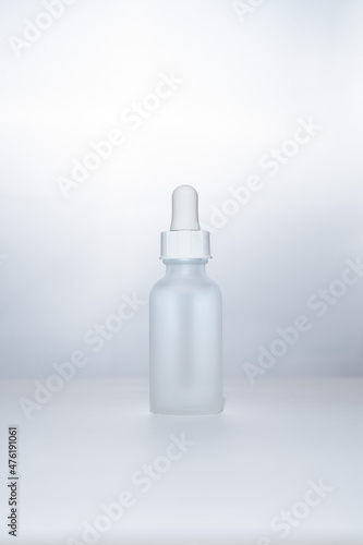 Light backlit face serum in matte bottle