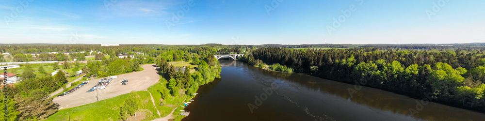Summer panoramic aerial view of bridge and Kymijoki river waters in Finland, Kymenlaakso, Kouvola, Koria