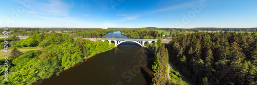 Summer panoramic aerial view of bridge and Kymijoki river waters in Finland, Kymenlaakso, Kouvola, Koria photo