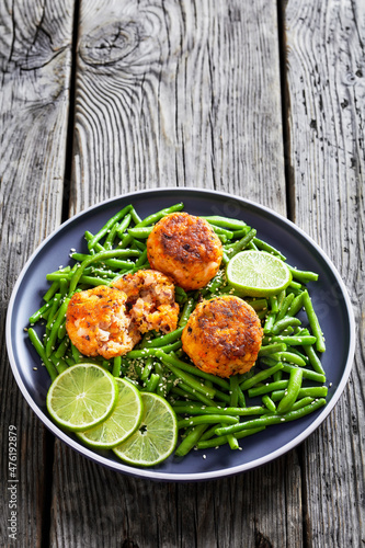 Prawn and Crab Cakes on a plate with green beans