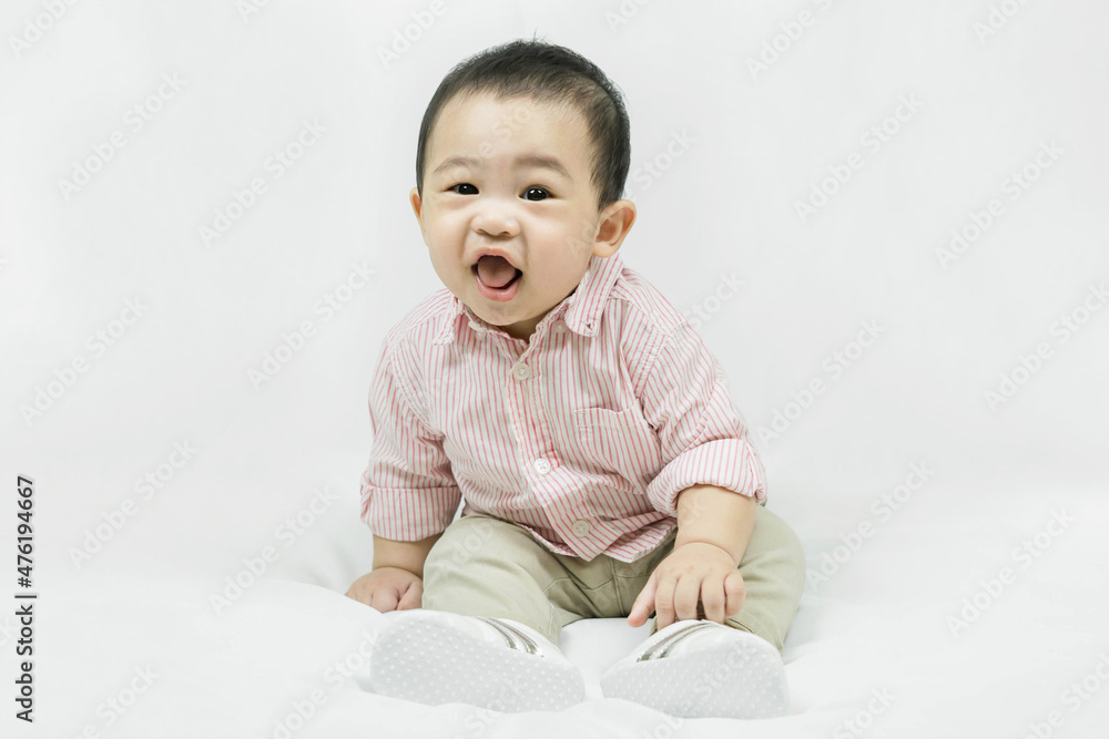 Stylish fashionable kid. Toddler baby boy model in casual clothes.Happy smiling Adorable asian
child in pink shirt sitting on white bedsheet.Fashion and Style. Stylish fashionable kid. Toddler baby boy model in casual clothes.Happy smiling Adorable asian
child in pink shirt sitting on white bedsheet.Fashion and Style.