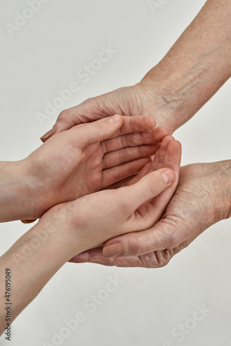Cropped of girl hands in hands of her grandmother