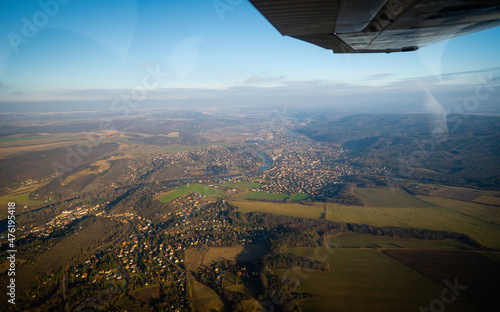 Beautiful aerial view of countryside during sunset from a Plane window. Selective focusing with shallow depth of field