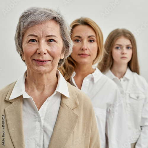 Row of serious three females looking at camera