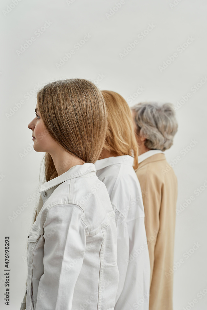 Side view of serious european female generations Side view of serious european female generations