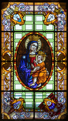 ROME, ITALY - AUGUST 29, 2021: The madonna in the stained glass in the church...