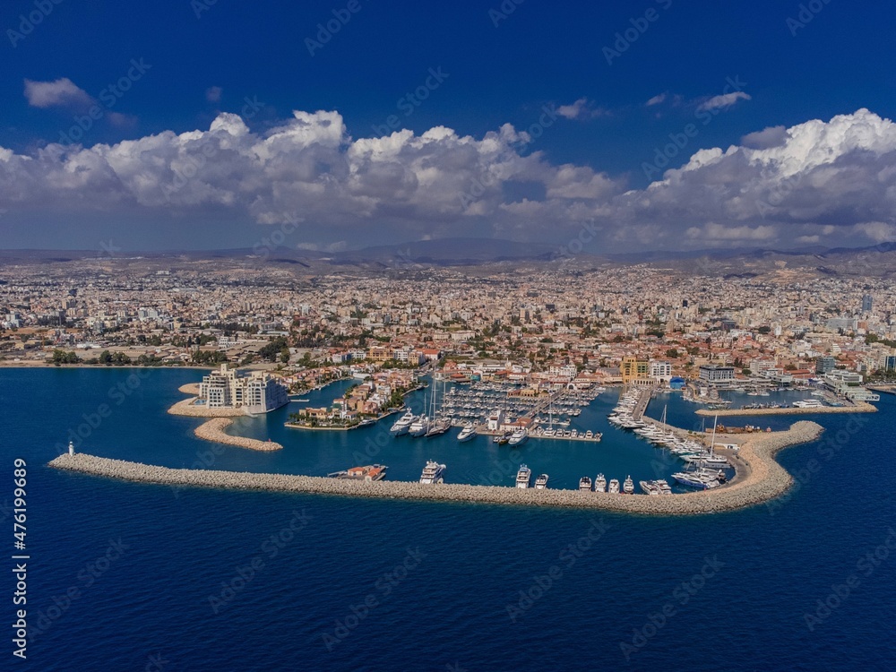 Aerial Drone Shot of Limassol Marina in Cyprus, blue Mediterranean Sea, yachts, boats