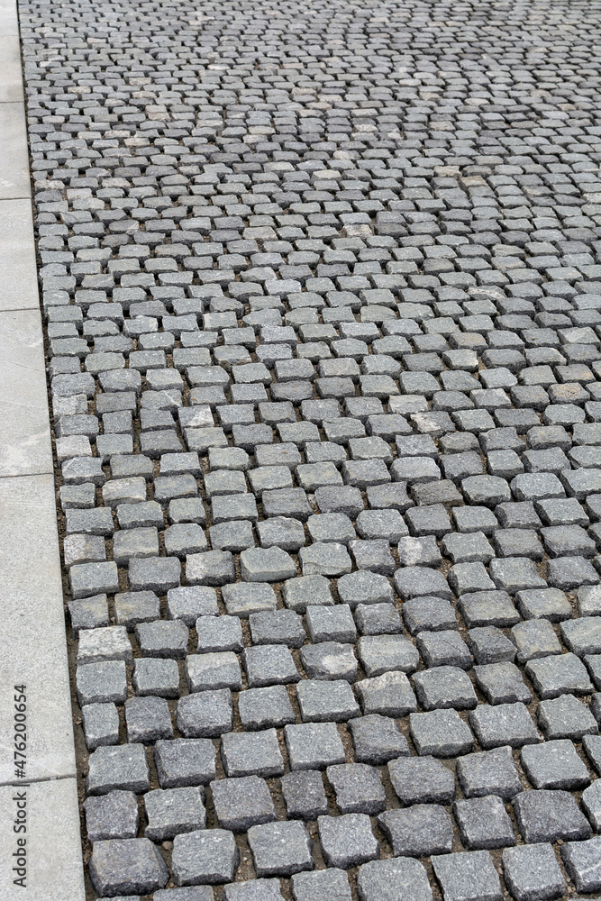 Fototapeta premium a sett used in paving streets, roads and walkways, rectangular quarried stone