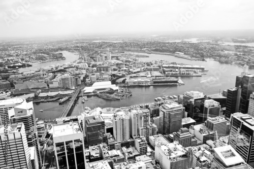Landscape view of city from top in black and white. Low angle view of big city and harbor in black and white. 