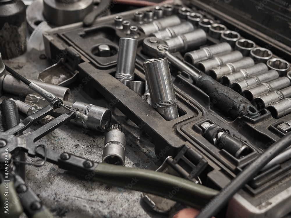 A set of tools and wrenches in a car workshop A set of tools and wrenches in a car workshop