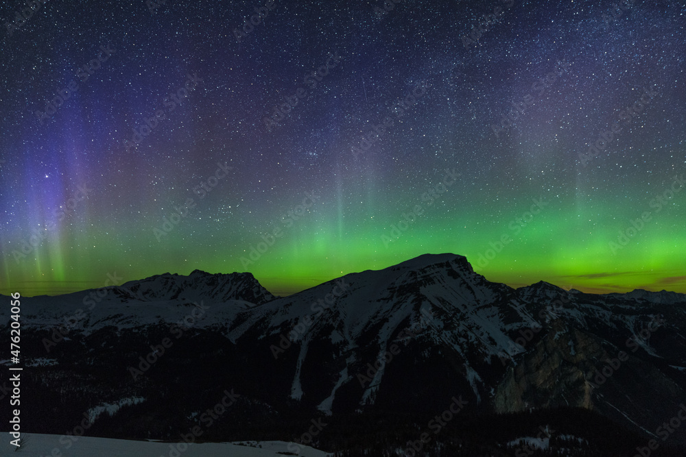 Beautiful green aurora dancing over Mt. Borgeau, Banff, Canada