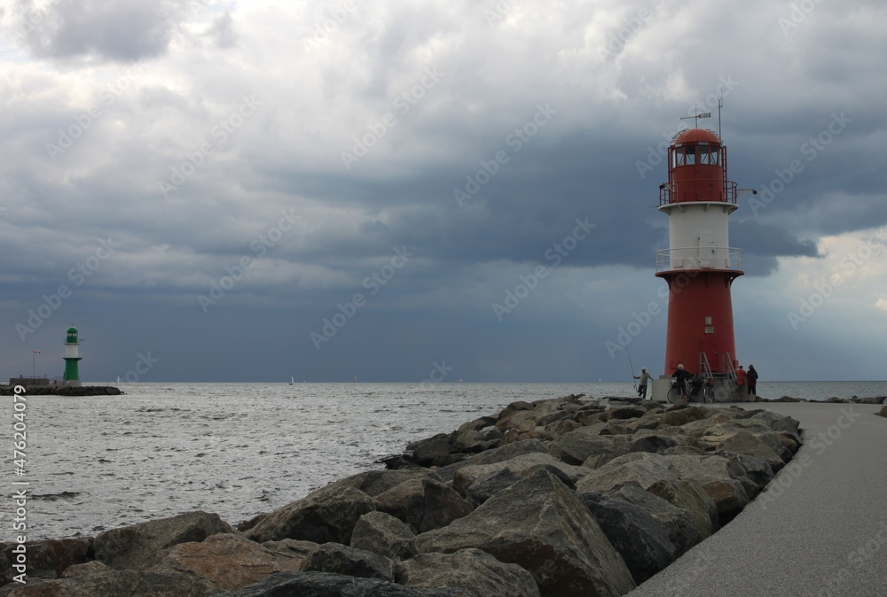 View of the harbor entrance of Warnemuende with 2 lighthouses View of the harbor entrance of Warnemuende with 2 lighthouses