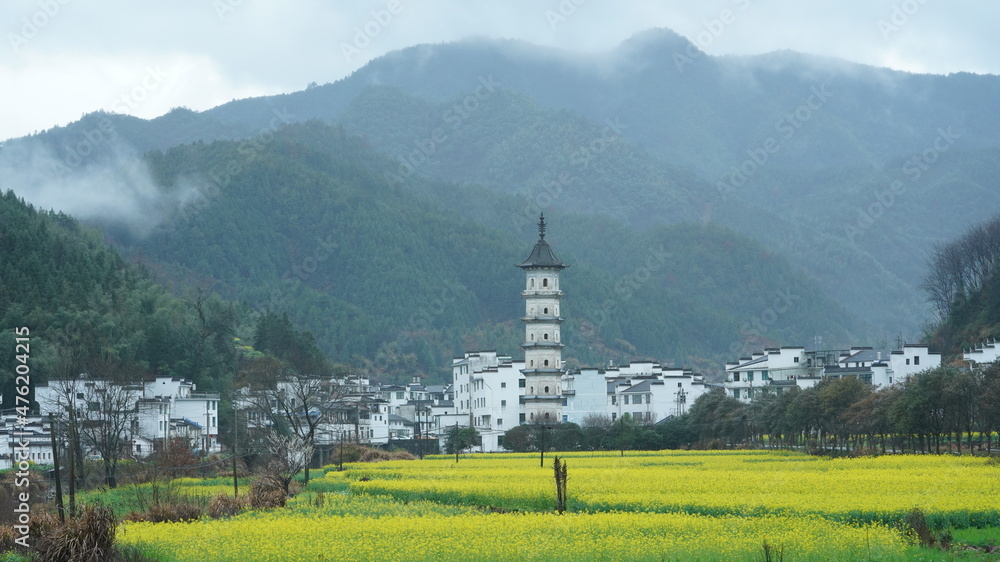 The  beautiful and old traditional Chinese village view with the mountains around it located in the countryside of the southern China 