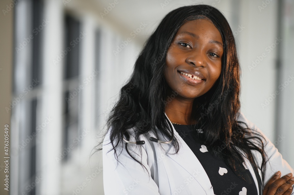 Portrait of African American woman doctor smiling in hospital Portrait of African American woman doctor smiling in hospital