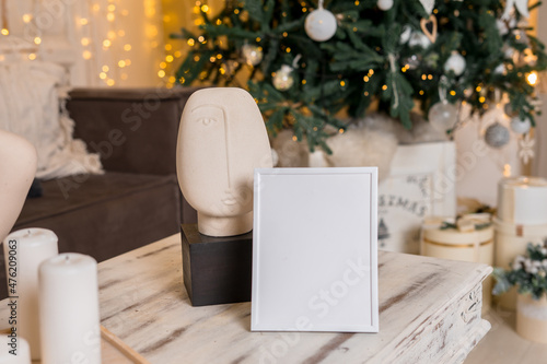 Christmas photo frame mock up template with decoration on wooden table.