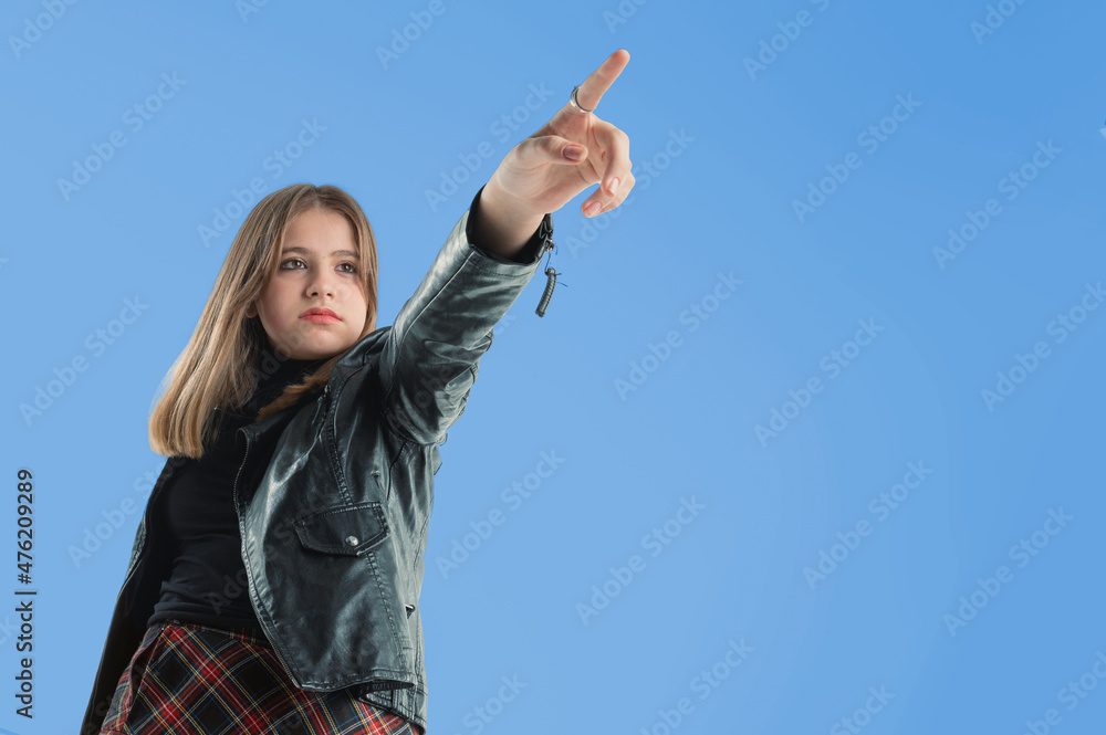 Portrait of a pretty girl pointing finger away Portrait of a pretty girl pointing finger away