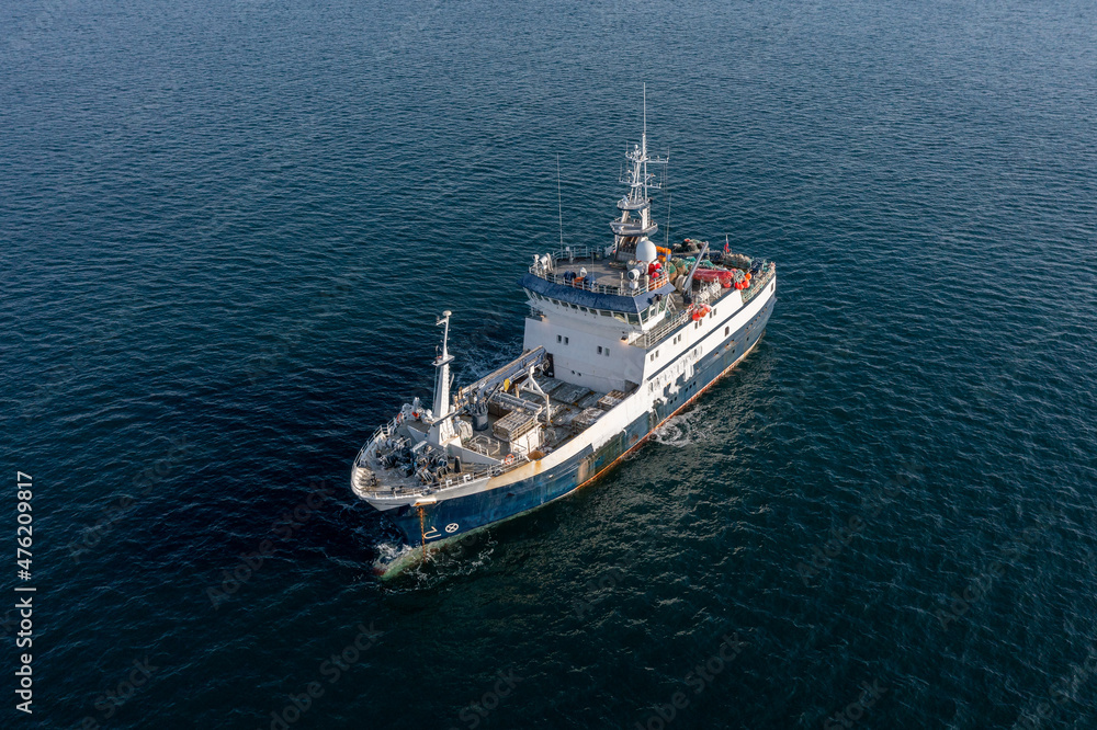 The fishing vessel to the sea.