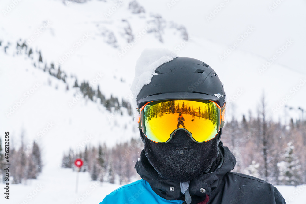 Skier man portrait in safe ski equipment
