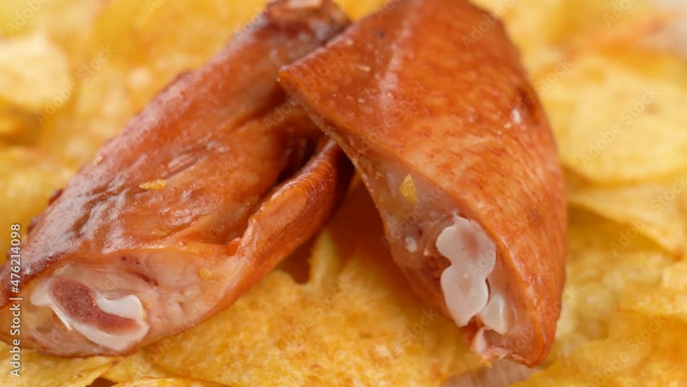 Potato chips and smoked chicken wings. Rotation. Potato chips and smoked chicken wings. Rotation.