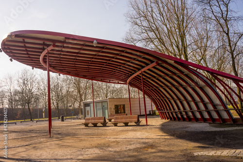 Tablou pe pânză Modern pavilion and wooden benches under that, Belgium, Bruges