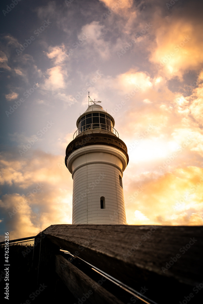 The beautiful white lighthouse in Byron Bay, NSW, Australia at sunset.