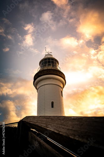 The beautiful white lighthouse in Byron Bay, NSW, Australia at sunset Fotobehang