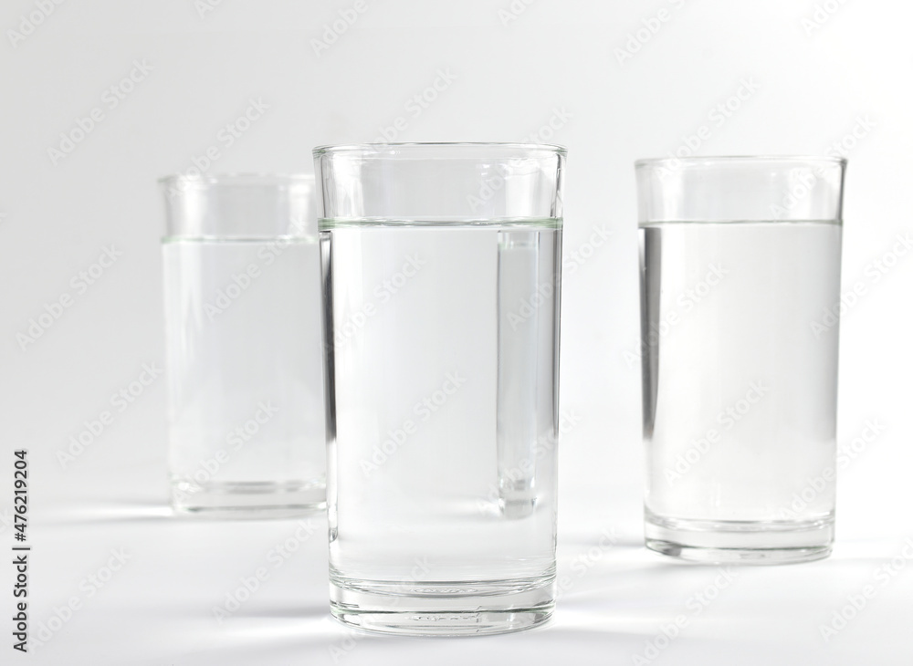 group of water glasses on a white background group of water glasses on a white background