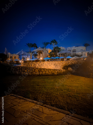 Palm trees and buildings in Sharm el Sheikh, Egypt. Bottom view. Structures and nature of Africa.