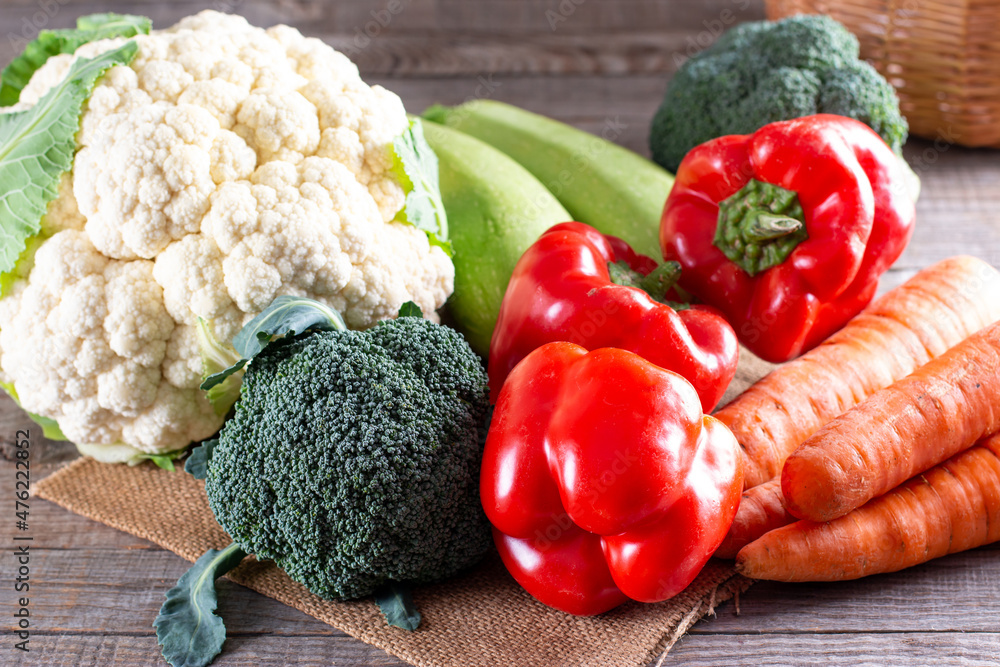 Fresh vegetables on a wooden table. Vegan food Fresh vegetables on a wooden table. Vegan food