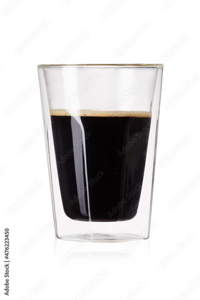 Detailed shot of a glass with a double bottom. The cocktail glass is transparent. The glass is with a black cocktail. The glass drinkware is isolated on the white background. Detailed shot of a glass with a double bottom. The cocktail glass is transparent. The glass is with a black cocktail. The glass drinkware is isolated on the white background.