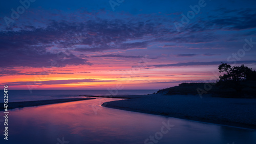 Obraz na płótnie Stony Creek flows into Lake Michigan at twilight, in Benona Township Park, Shelby, Michigan