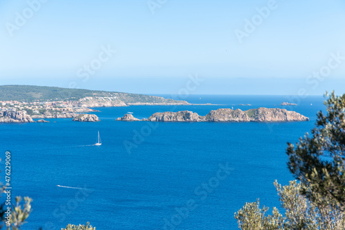 Panoramic of the Malgrats Islands and the coast of Mallorca. Blue Mediterranean sky and sea, boats can be seen in the sea photo