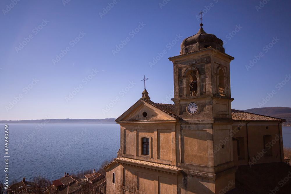 Church of the Assumption of Mary in panoramic views ,built around 1500 with The square bell tower.Trevignano Romano,Italy Church of the Assumption of Mary in panoramic views ,built around 1500 with The square bell tower.Trevignano Romano,Italy