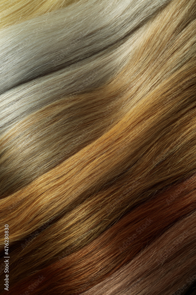 Different color female hair on whole background, close up Different color female hair on whole background, close up