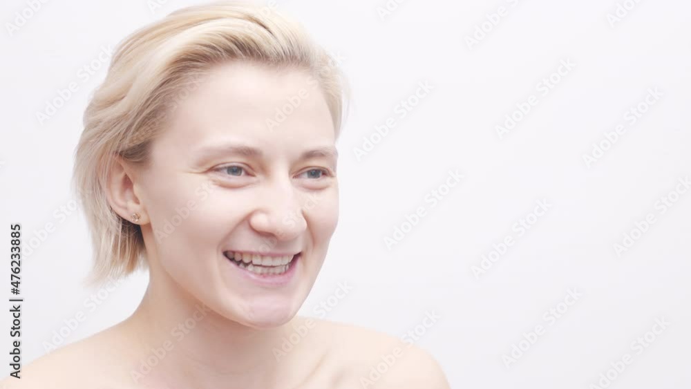 Smiling Woman Placing Dental Night Mouth Guard For Teeth Clenching, Close Up, Studio Shot on White Background Smiling Woman Placing Dental Night Mouth Guard For Teeth Clenching, Close Up, Studio Shot on White Background