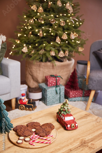 Chocolate cookies and candies against Christmas decor