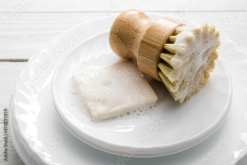 Fotografie Solid dish washing soap, covered with foam