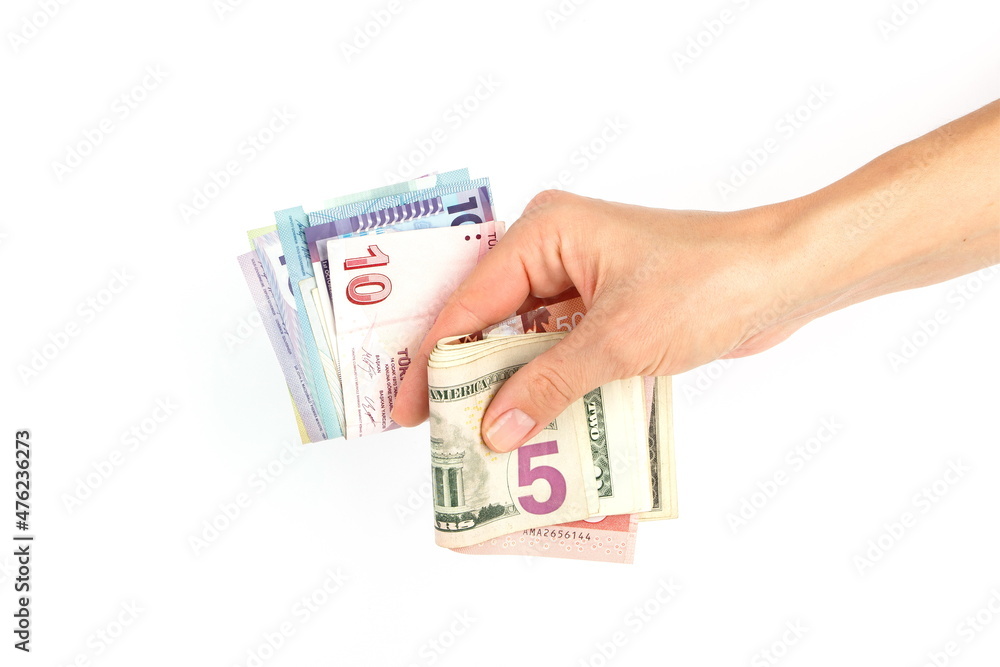 Different money from all over the world in the hand Different money from all over the world in the hand