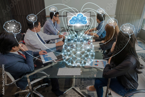 Obraz na płótnie Group Of Asian and Multiethnic Business people brainstorming and working with brain and virtual screen connecting with cloud technolog in the modern workplace, business group and technology concept w salonie