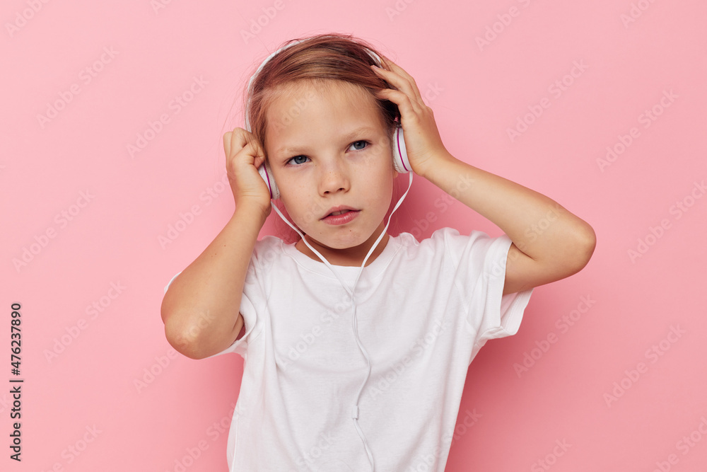 Portrait of happy smiling child girl smile posing headphones isolated background Portrait of happy smiling child girl smile posing headphones isolated background