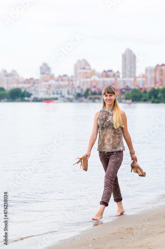 Young woman on the banks of the Dnieper river..