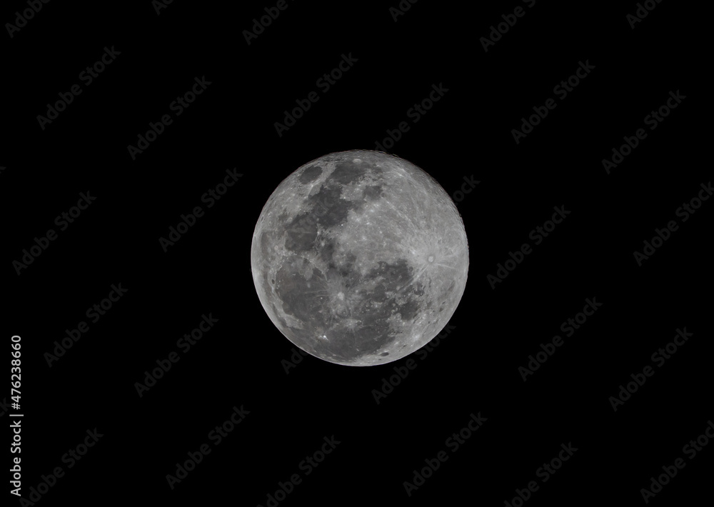 Close up photography of the moon with a telephoto lens, very sharp and detailed where you can see crates in a full moon phase. Close up photography of the moon with a telephoto lens, very sharp and detailed where you can see crates in a full moon phase.