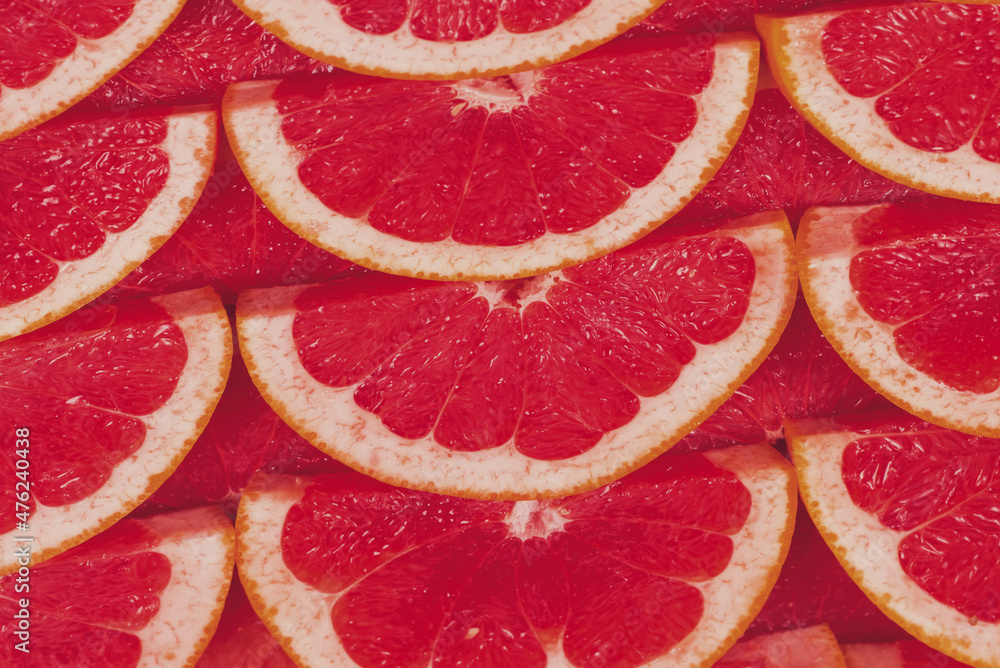Grapefruit red juicy slices background. top view. Grapefruit red juicy slices background. top view.