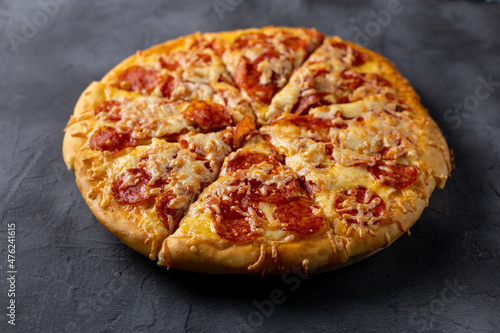 Tasty hot homemade pepperoni pizza. Traditional classic pizza with salami and cheese