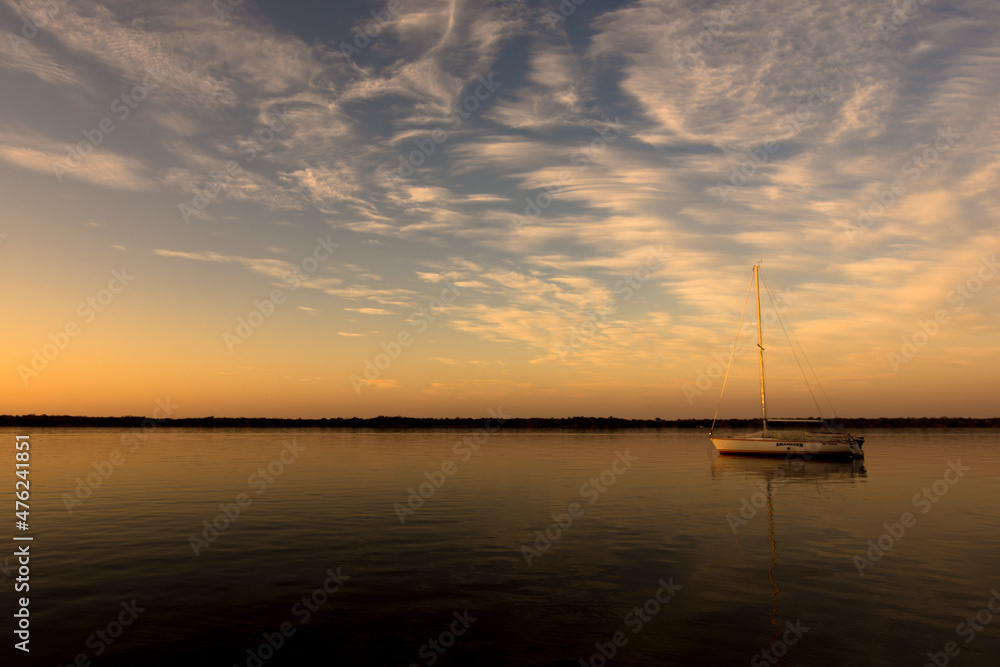 Anchored Sailing boat at sunset in Uruguay River. Colón, Entre Ríos, Argentina
Anchored Sailing boat at sunset in Uruguay River. Colón, Entre Ríos, Argentina