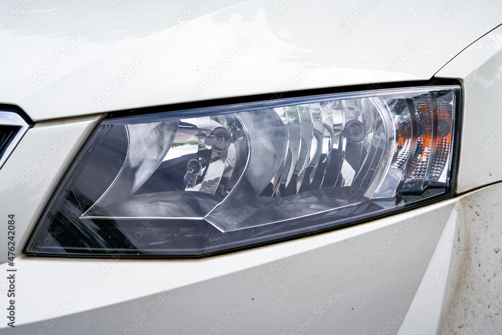 Close-up of the headlight of a modern car