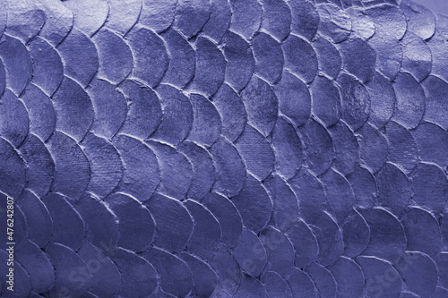 Close up pattern of mermaid or fish scales tiles toned in trendy color of the 2022 year photo